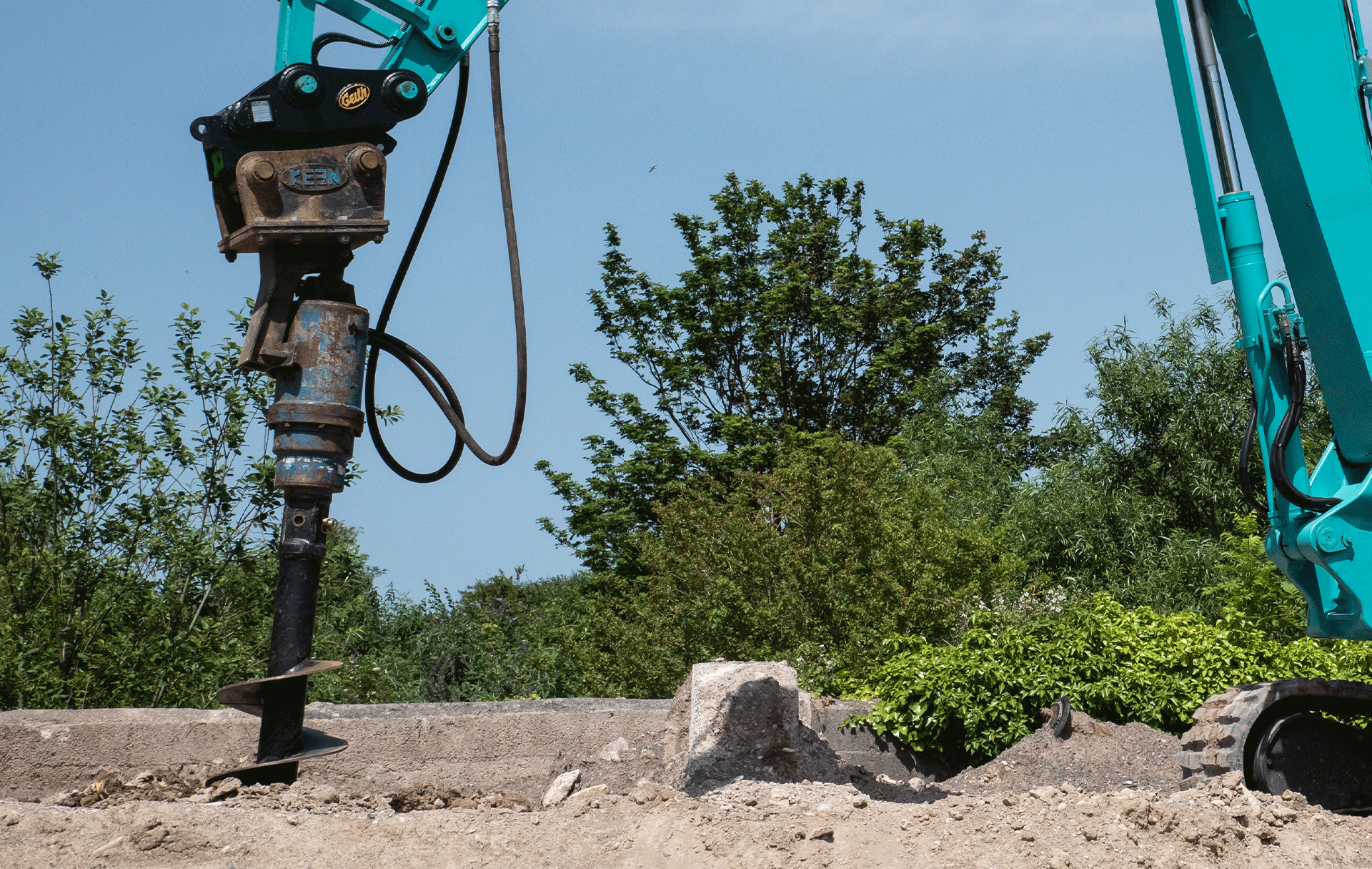 Plantforce Auger Attachment Operating On Site